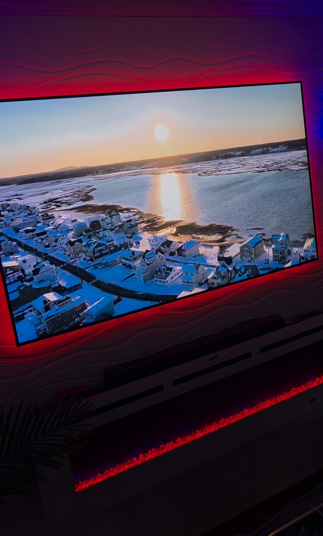 Mounted television with red bias backlighting and hidden wiring