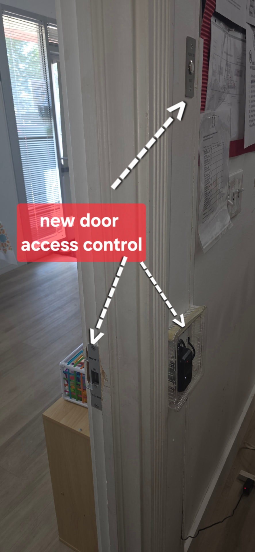 New door access control install with exit push button, electric strike, and reader wired at an office door
