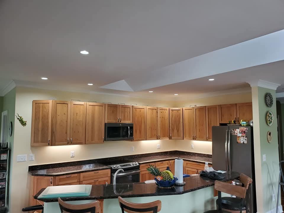 Kitchen with new LED recessed cans and warm under-cabinet lighting